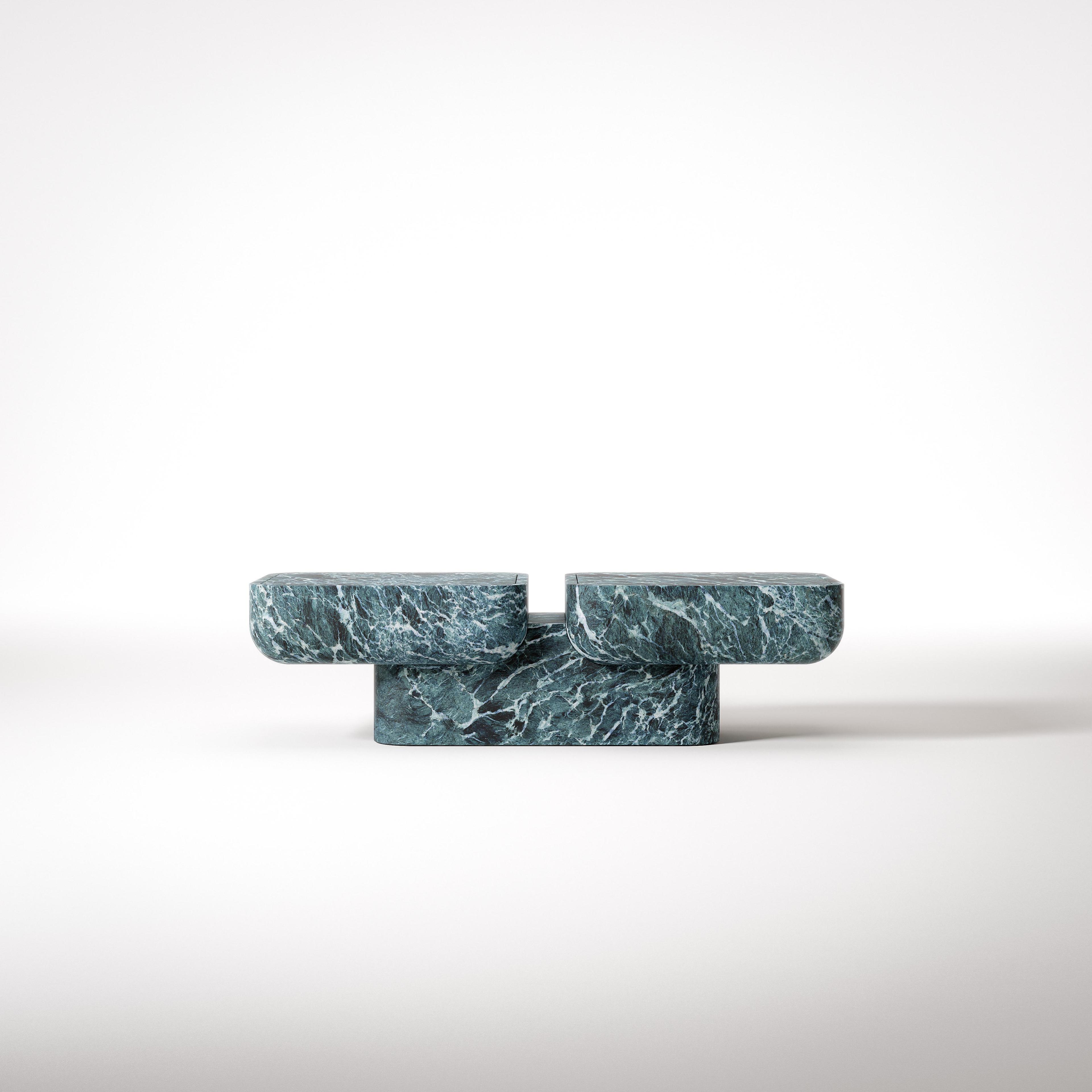Supernova modular table by Giulio Zizzari – three interlocking dark green marble blocks, Urano